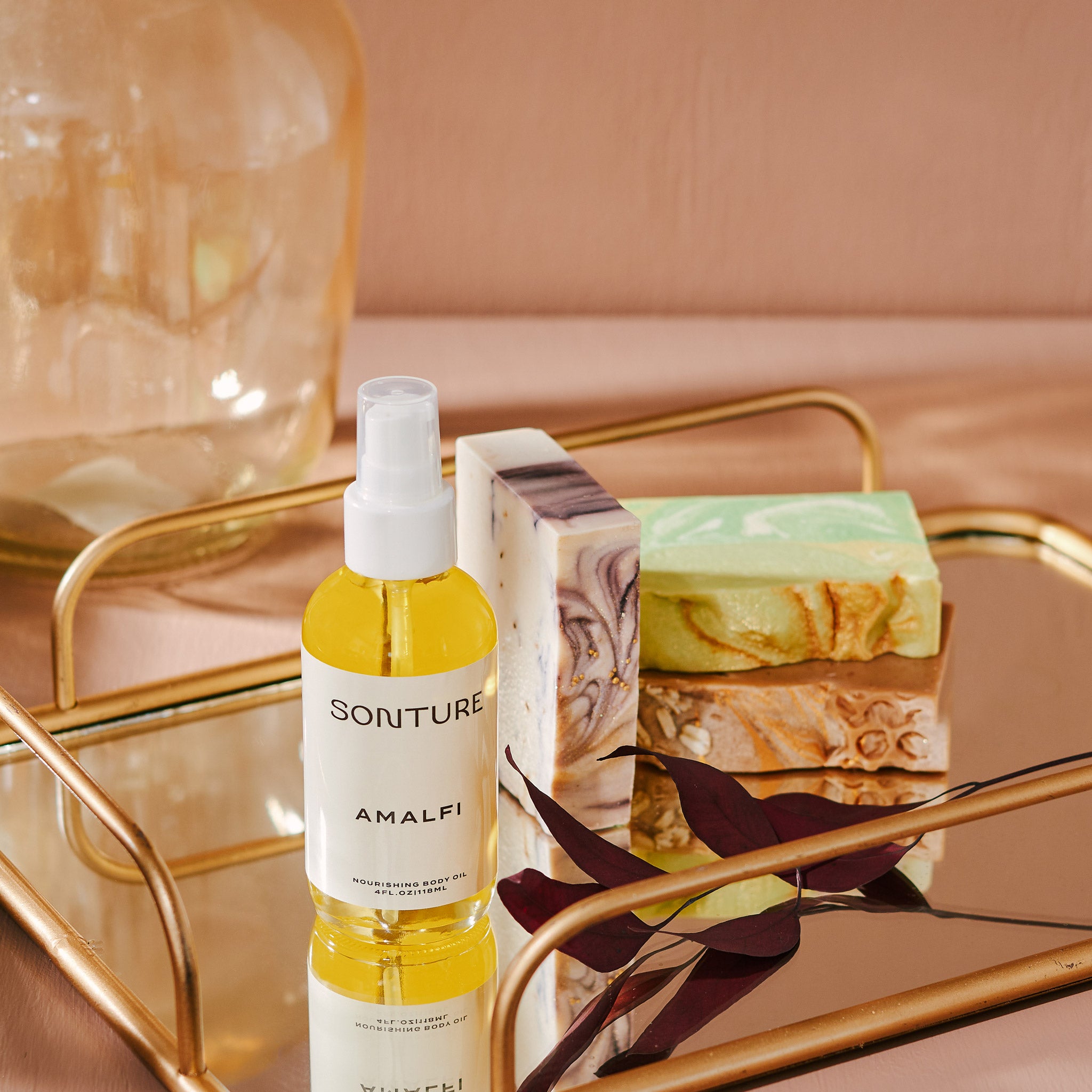 A collection of Sonture’s handmade, ethically created body care products inspired by travel. The products are styled on a gold tray and look high end, Luxurious and perfect for glamorous bathrooms.