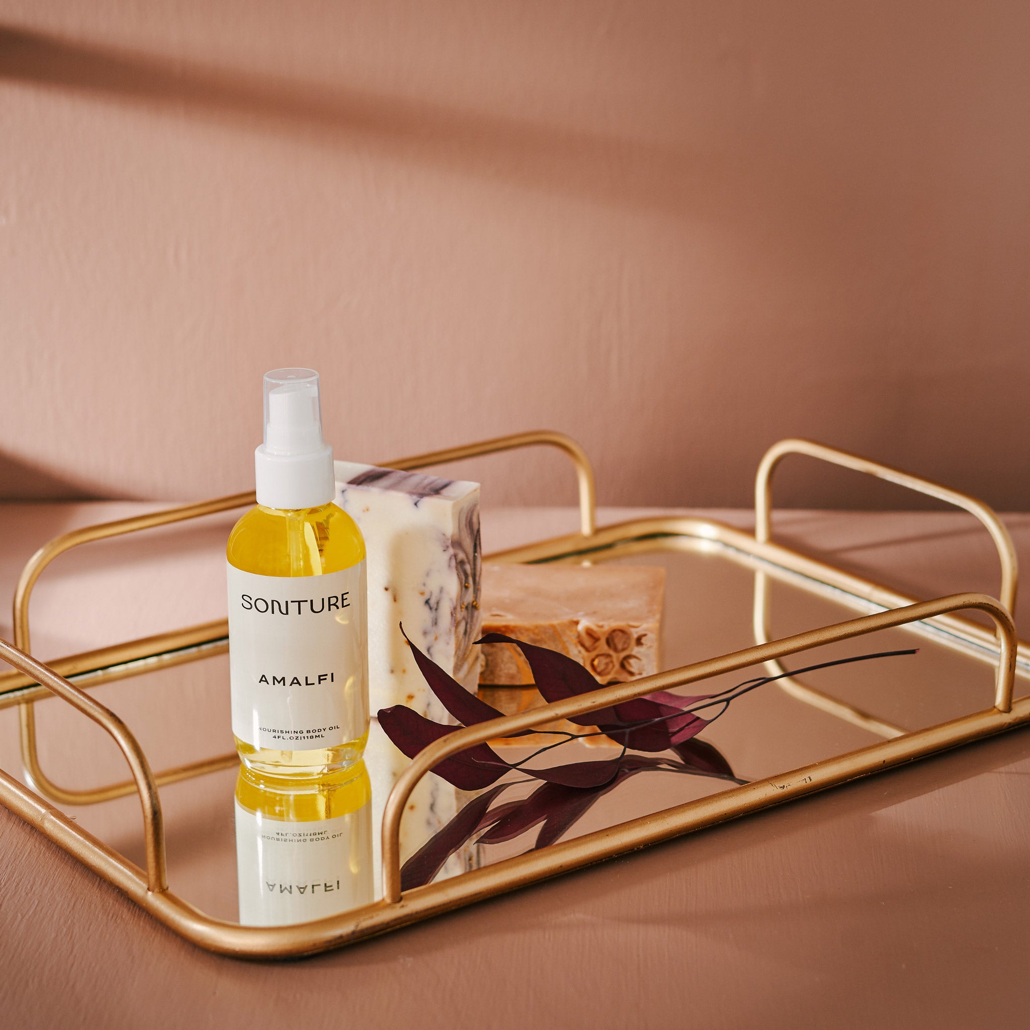 A collection of Sonture’s handmade, ethically created body care products inspired by travel. The products are styled on a gold tray and look high end, Luxurious and perfect for glamorous bathrooms.