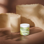 Sonture body scrub Angkor sits in a beige background with paper styling. The packaging is clear so as to show the product detail and the ethically sourced handmade nature of the travel inspired product.